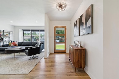 Foyer featuring light wood finished floors and recessed lighting