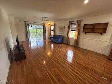Unfurnished living room with ornamental molding, w
