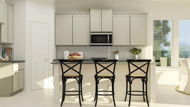 Kitchen with a kitchen breakfast bar and backsplas