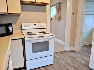 Kitchen featuring white electric range oven and li