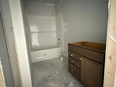 Bathroom with concrete flooring and vanity