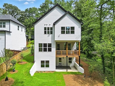 Rear view of property with a patio area
