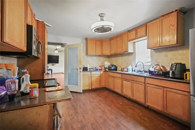 Kitchen featuring dark hardwood / wood-style floor