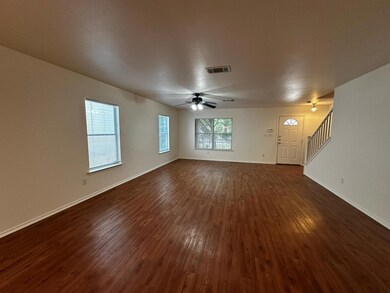 Unfurnished living room featuring dark wood-style