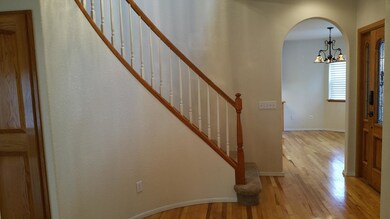 Entry and oak rail staircase