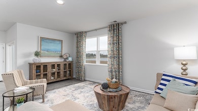 Living area with a water view and wood-type floori