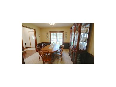Formal Dining Room with Carpet and Window facing f