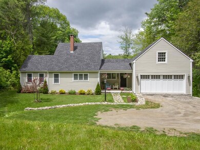 The attached 2 car garage has a full...