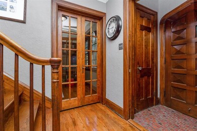 Original tile floors in the entry, beautiful woodw