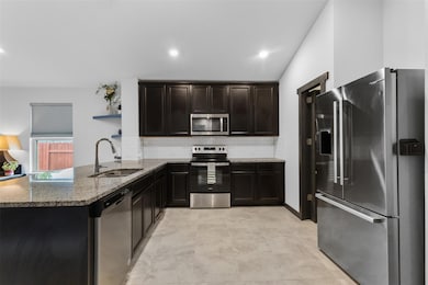 Kitchen featuring stainless steel appliances, sto