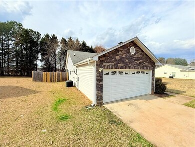 View of home's exterior with cooling unit, fence, 
