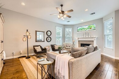 Living area featuring dark wood-type flooring, a 