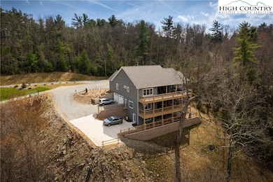 Rear View Showing 2 Large Decks and Airbnb Patio