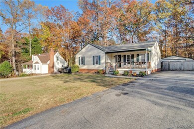 Single story home with a front yard and covered po