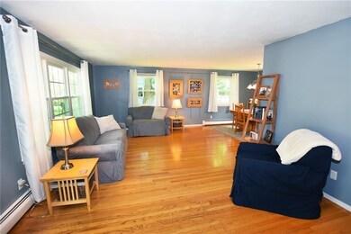 The Living and Dining Rooms feature Gleaming Hardw