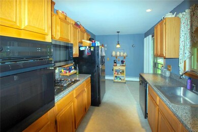 Oak Cabinets with Gas Range and Electric Oven