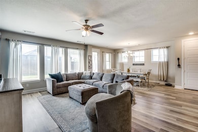 Living area featuring light wood-style floors, vis