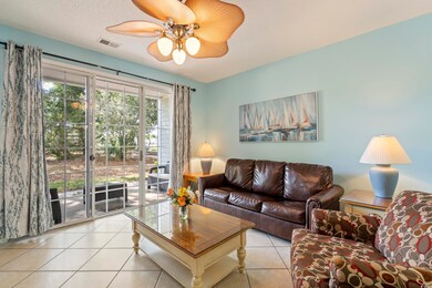 Living area featuring light tile patterned floors,