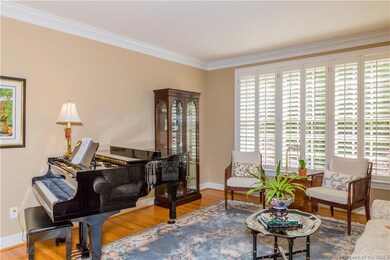 Hardwood flooring and crown molding throughout the