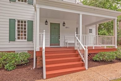  Front Doorway to property with wide covered porch