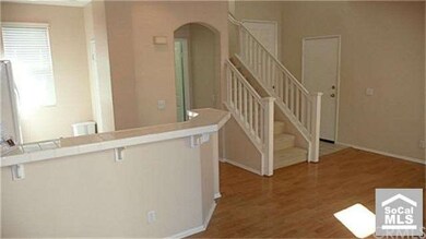 Entry and stairs leading to the bedrooms and upsta