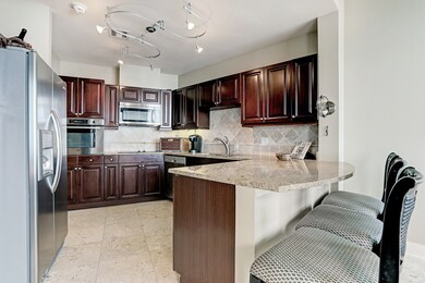A separate cook top and oven and custom back splas