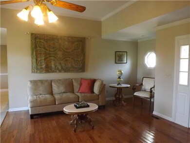 Open and spacious great  room.  Neutral colors and hardwoods make this a very appealing place to relax!