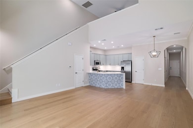 Unfurnished living room featuring light wood-styl