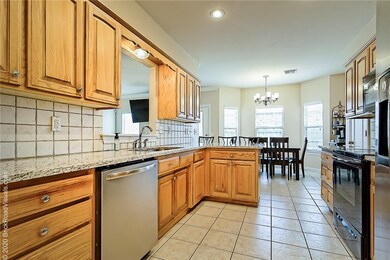 Large kitchen with granite countertops