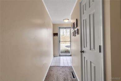Foyer with coat closet and a storage area for boot