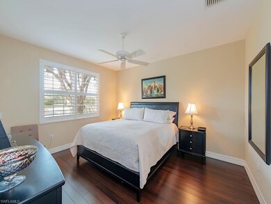 Main bedroom with plantation shutters and access t