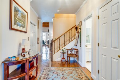 Foyer entrance featuring hardwood / wood-style flo