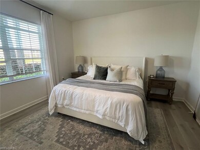 Bedroom with dark wood-type flooring