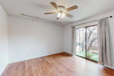 Spacious living room with rail lighting, baseboard