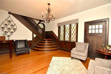 Foyer is grand and has room to sit or greet many guests, the stair case has a beautiful outlet into foyer space. There is a door onto a side porch as well.