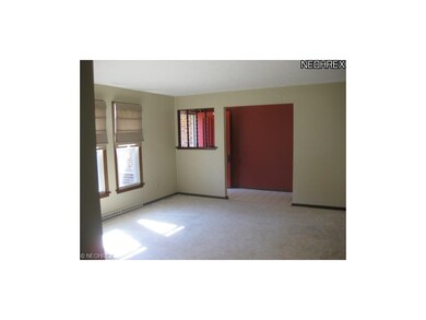 The living room off the foyer is very spacious at 