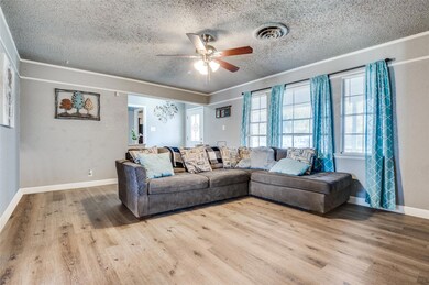 Living room featuring plenty of natural light, a t