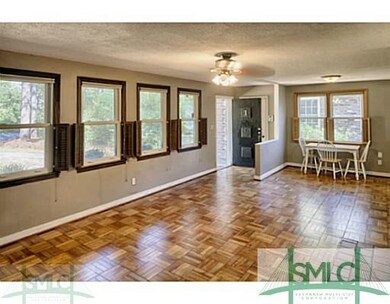 Foyer. Original parquet floors & lots of new, doub