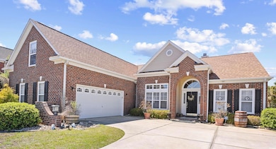 View of front of property with brick siding, concr