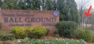 View of community sign with our house in the backg