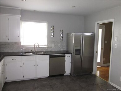 Granite countertops, stainless steel appliances an