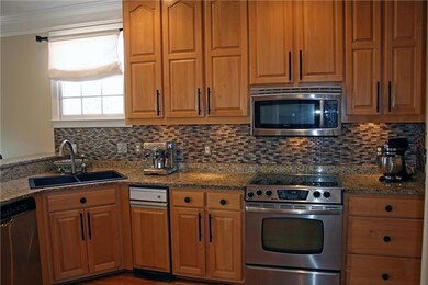 Updated kitchen with stainless, granite, glass tile