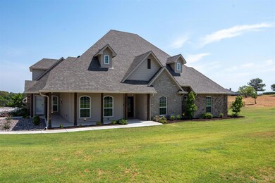 Partial wrap porch offers two separate entries. One to home and other to office space.