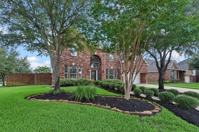 This home oozes with curb appeal and gorgeous landscaping.