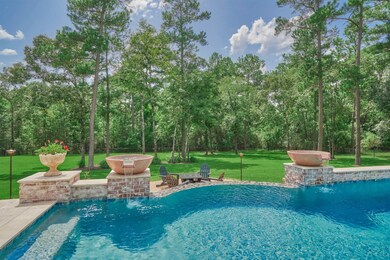 The stunning modern design reverse negative edge pool was added in 2019 and constructed with piers and travertine tile.The Bioshield system with UV Stabilizer neutralizes the bacteria all while using less chlorine.  A lower level sitting area around the firepit adds another entertaining space.
