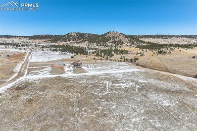 Snowy aerial view featuring a mountain view