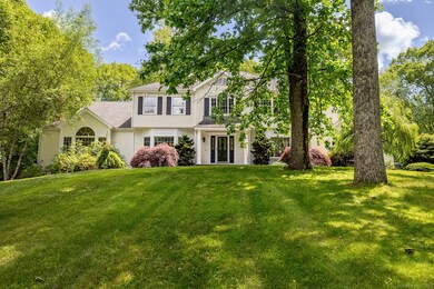 Professionally landscaped with many specimen trees