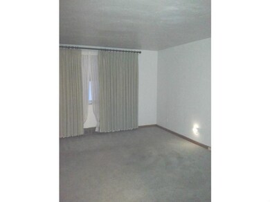 Living Room. Large picture window and drapery in y