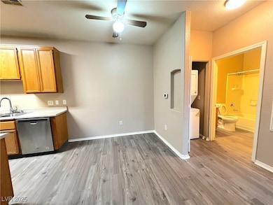 Kitchen featuring stainless steel dishwasher, esta