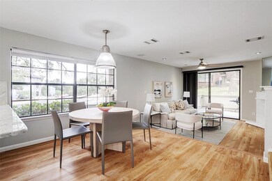 Dining area with light wood-style flooring, baseb